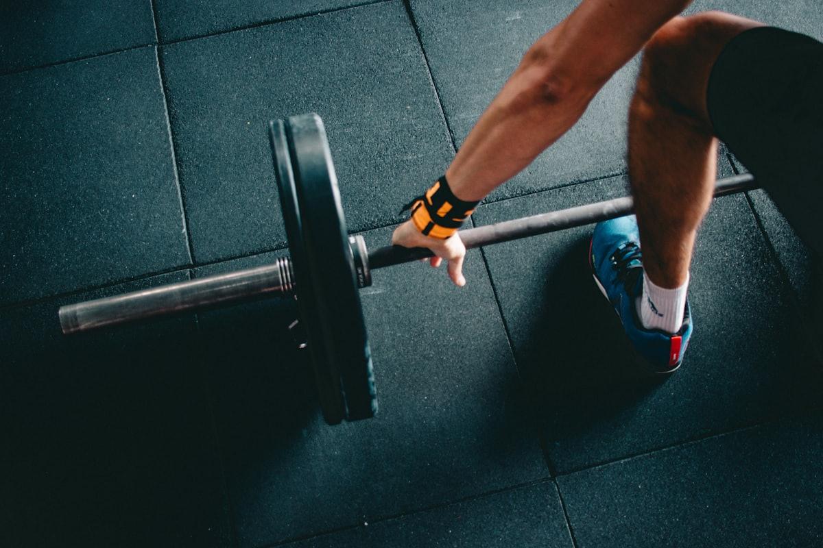 Personal trainer coaching a client through a strength session