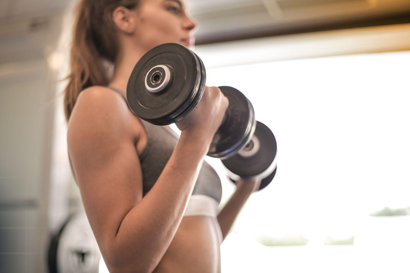 A personal trainer coaching a client through a session