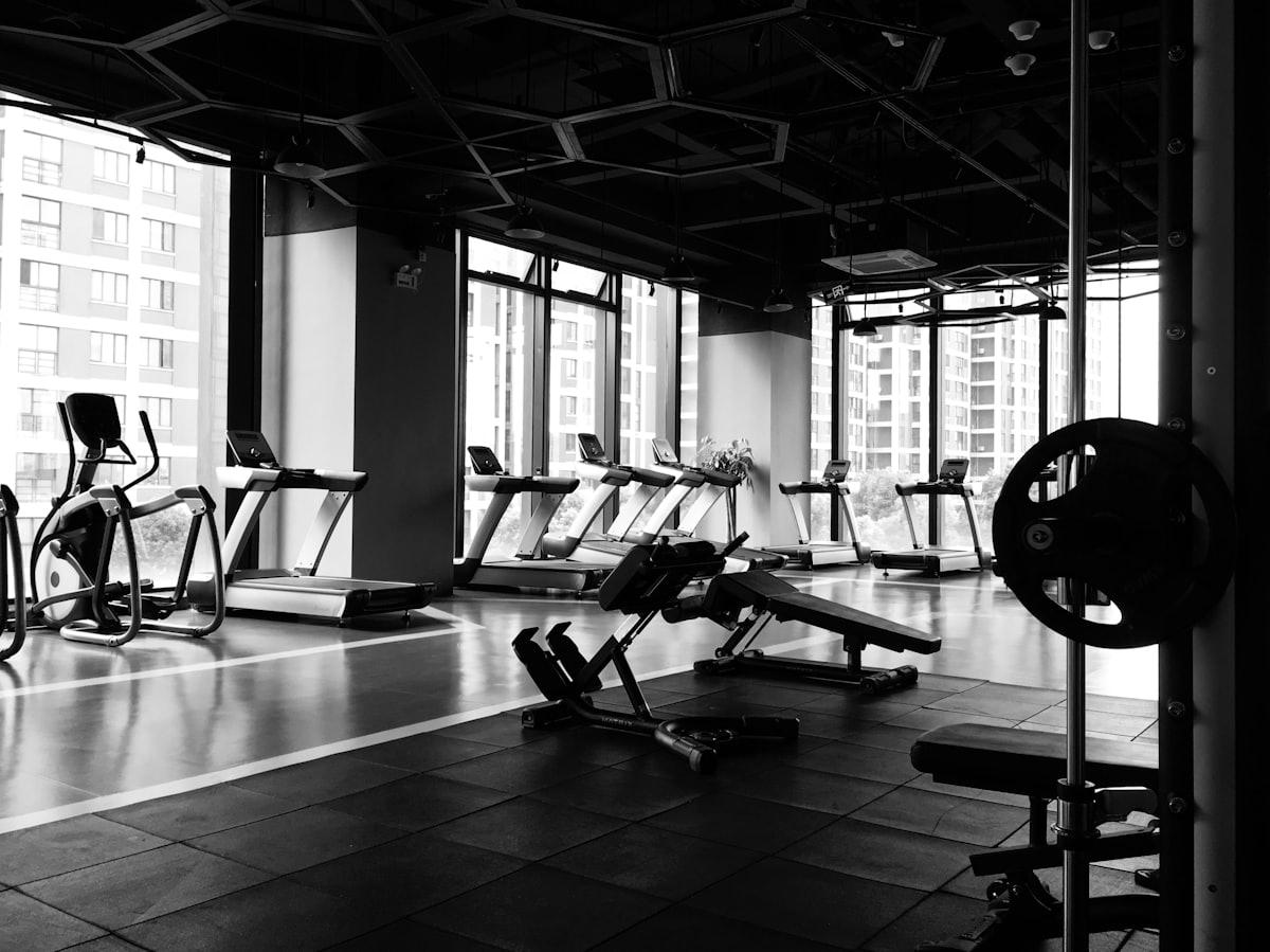 Personal trainer coaching a client outdoors in Singapore